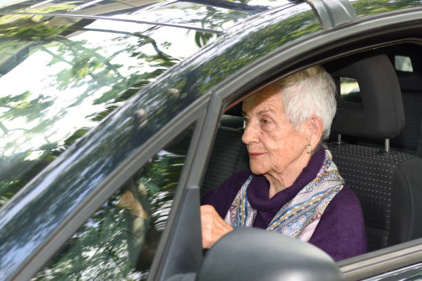 istock senior woman driving a car 682201760