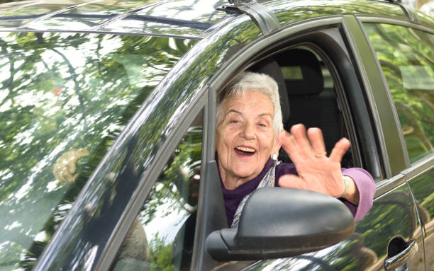 istock senior woman driving a car 682201896