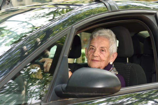 istock senior woman driving a car 682204392