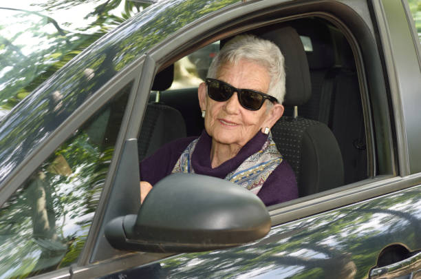 istock senior woman driving a car 682204566