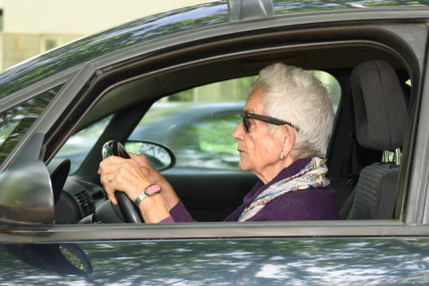 istock senior woman driving a car 682205050