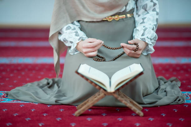 istock muslim woman praying in mosque 682205330