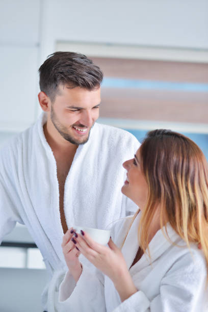 istock Portrait of a couple in the kitchen and using a laptop 682208078