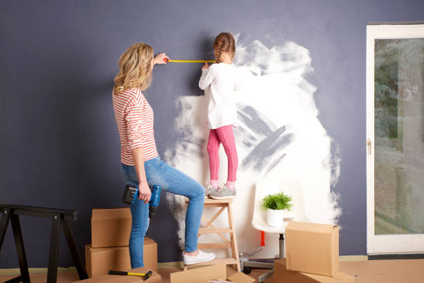istock Painting wall in new home 682208422