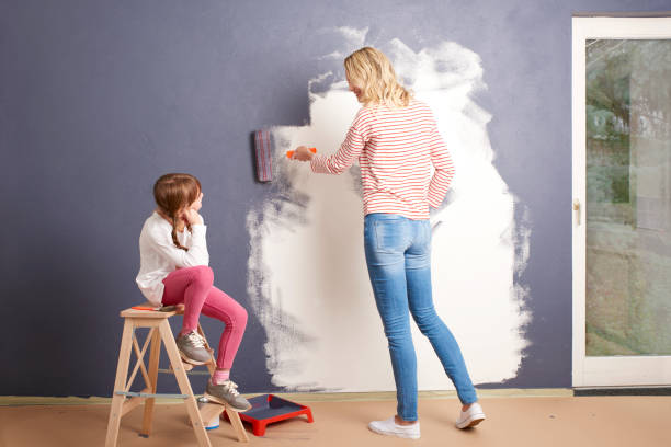istock Painting wall in new home 682208470