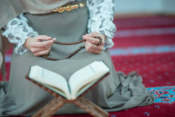 istock muslim woman praying in mosque 682208502