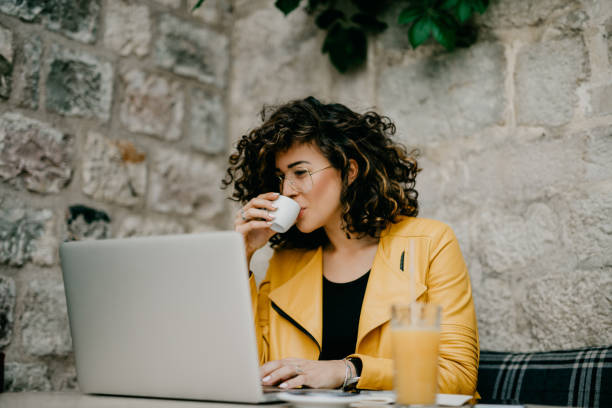 Coffee break for a beautiful curly-haired girl
