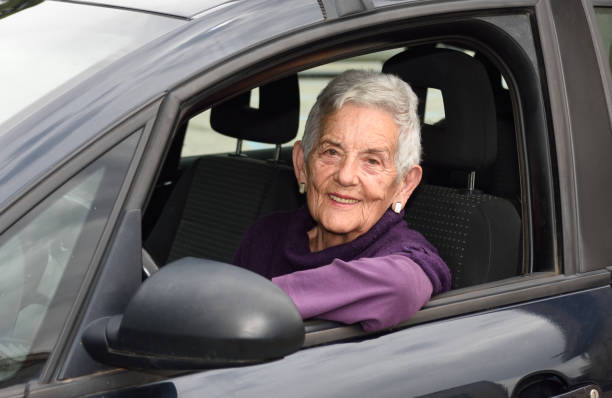 istock senior woman driving a car 682211826