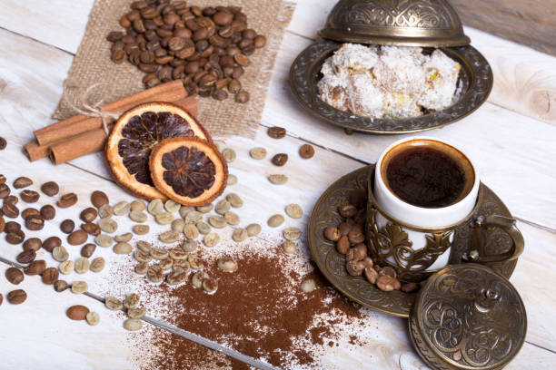 istock Turkish coffee with delight and traditional copper serving set on wooden 682212098