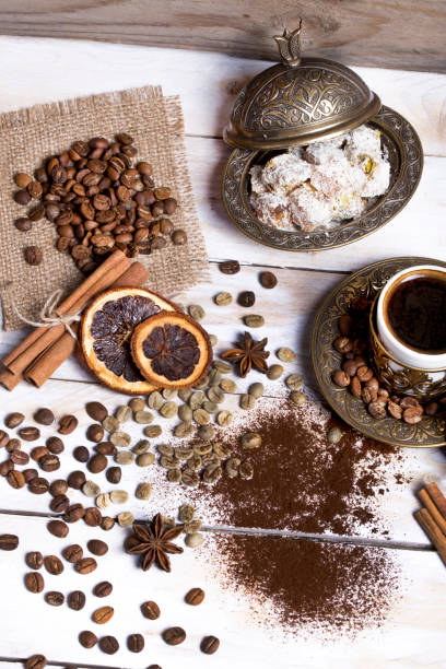 istock Turkish coffee with delight and traditional copper serving set on wooden 682212182