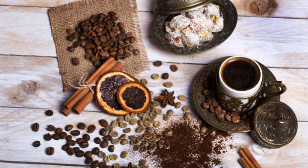 istock Turkish coffee with delight and traditional copper serving set on wooden 682212220
