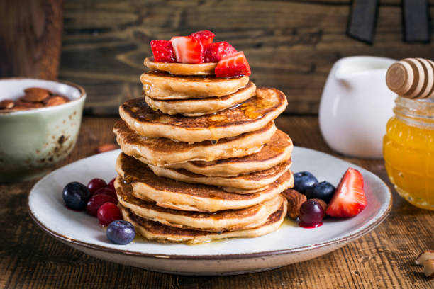 istock Oat pancakes with honey, strawberries 682212252