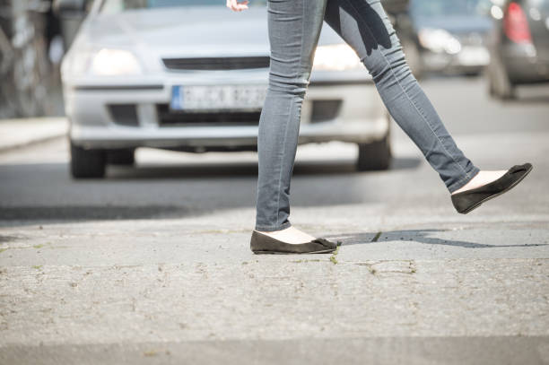 istock Woman crossing street 682212434