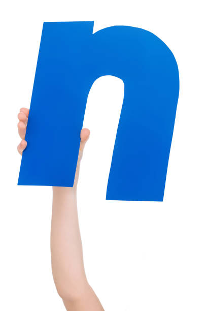 istock alphabet letter in child hand 682222076