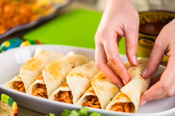 istock Preparing homemade chicken enchiladas 682222886