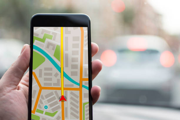 istock GPS Navigation on Mobile Phone Device and Transportation Concept. Male Hand Using Navigation System Map Tracking on Smartphone with Copy Space. 682224522