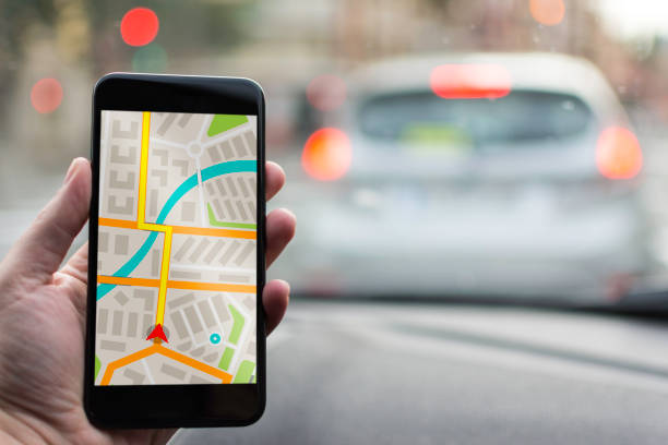 istock GPS Navigation on Mobile Phone Device and Transportation Concept. Male Hand Using Navigation System Map Tracking on Smartphone with Copy Space. 682228694