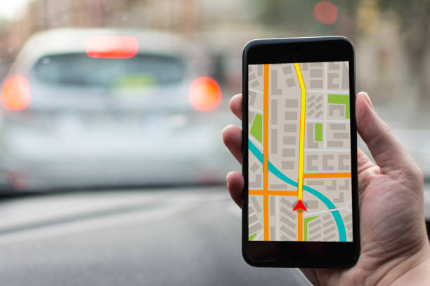 istock GPS Navigation on Mobile Phone Device and Transportation Concept. Male Hand Using Navigation System Map Tracking on Smartphone with Copy Space. 682228872