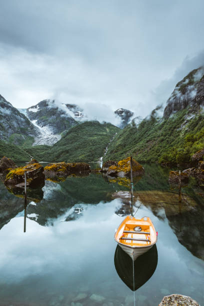 istock Fishing boat on mountain lake Norway 682236062