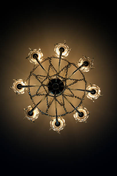 istock View from below electric ceiling lamp shines with yellow light 682236774