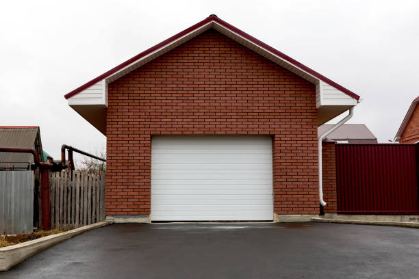 istock Garage of red brick with white gates 682238978
