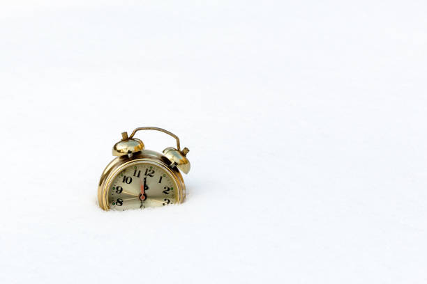 istock old clock in the pure white snow 682239646