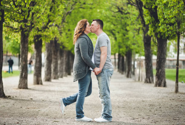 istock Happy loving couple outdoors in a park 682240474