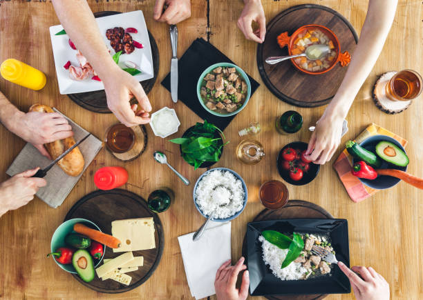 istock Top view, Group of people sitting at the table having meal 682247152