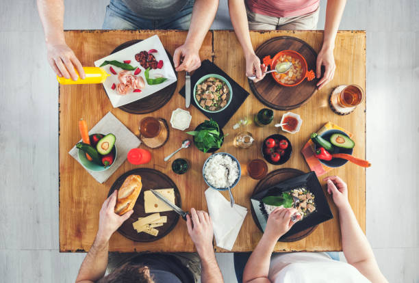 istock Top view, Group of people sitting at the table having meal 682247500
