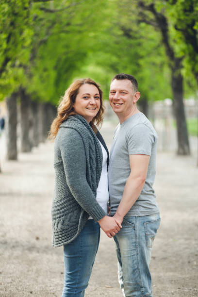 istock Happy loving couple outdoors in a park 682248124