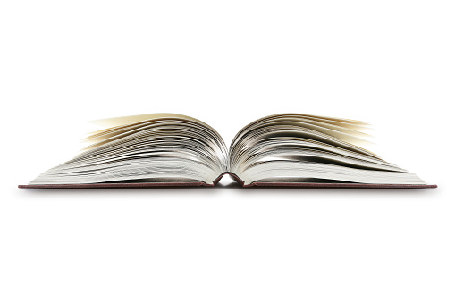 Shot of an open book isolated on a white background with copy space and clipping path. The pages are fanned out giving the appearance of shape.