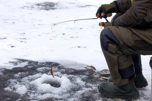 istock winter fishing 682251634