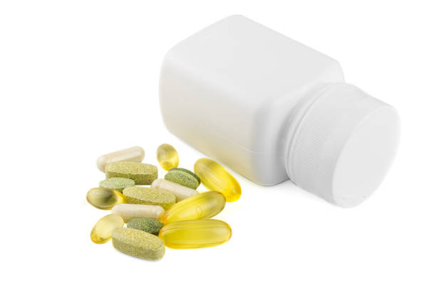 istock Vitamin complex, omega 3, glucosamine capsules, multivitamin supplements and white container isolated on white background 682254572