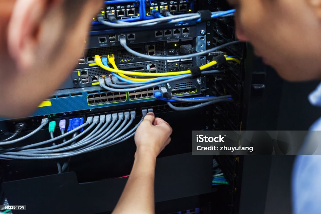 Insecting Computer Cables Young It Engineer Inspecting Network Cable Stock Photo - Download Image ...