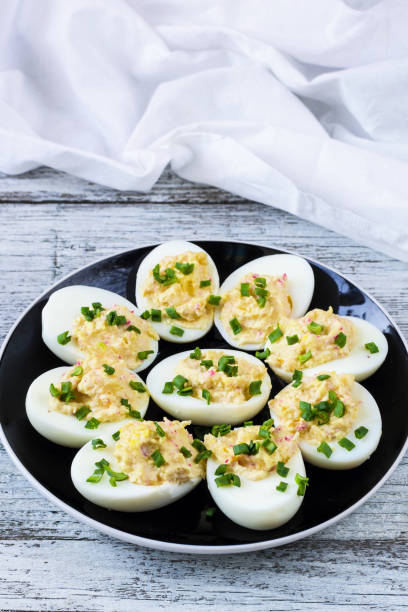 istock Home eggs stuffed with cheese and crab topped with green onions 682255256