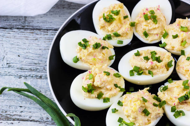 istock Home eggs stuffed with cheese and crab topped with green onions 682255258