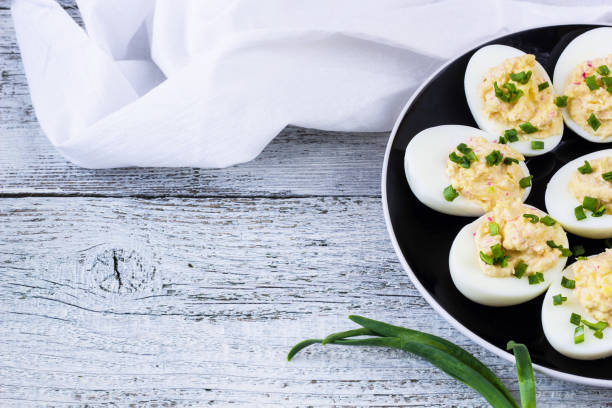 istock Home eggs stuffed with cheese and crab topped with green onions 682255262