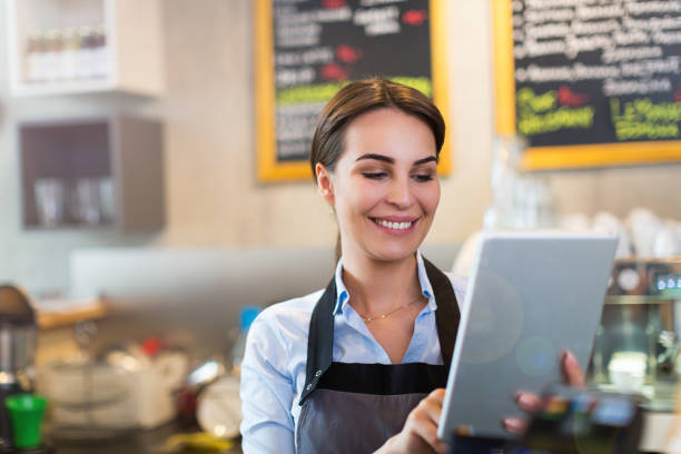 istock Woman working in coffee shop 682257640