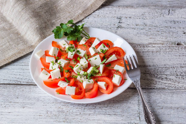 istock Fresh salad with tomato, mozzarella and herbs. 682257784