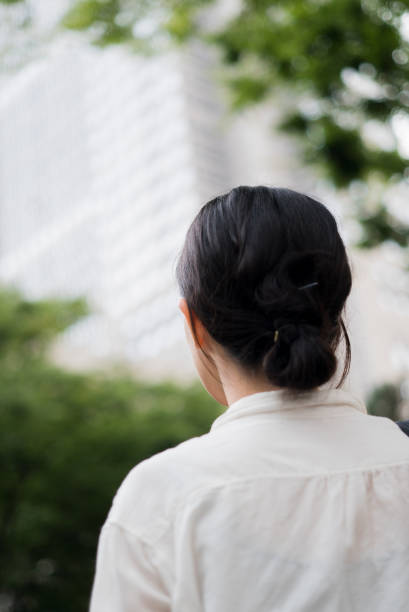 istock Woman looking at office buildings 682258144