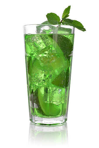 Drink with lime, ice and mint isolated on white background