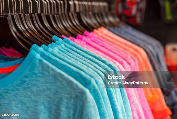 Row Of Colored Tshirts In A Store Stock Photo - Download Image Now - T-Shirt, Clothing, Pattern