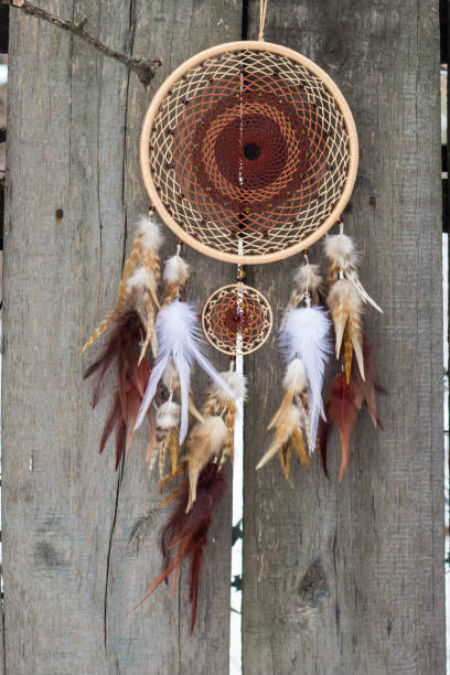 istock Dreamcatcher made of feathers, leather, beads, and ropes 682264570