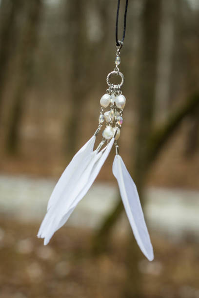 istock White pendant with feathers and beads handmade 682269000