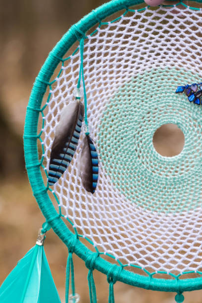 istock Dreamcatcher made of feathers, leather, beads, and ropes 682269050
