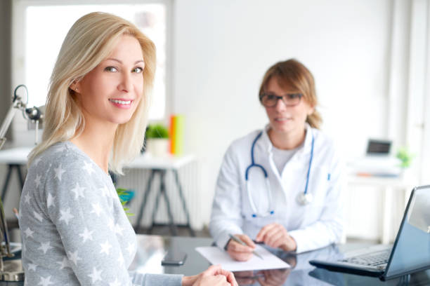 istock Patient consulting with doctor 682269460