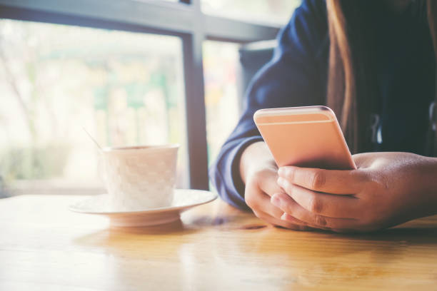 istock woman using on mobile phone during rest in coffee shop 682272040