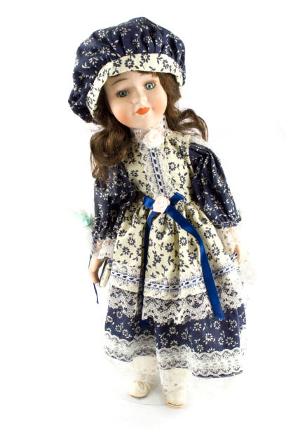 istock Girl Toy Doll on Black Background 682275276