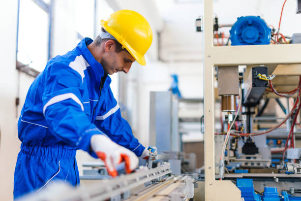 istock Packaging line in factory with expert engineer checking the machinery 682278942