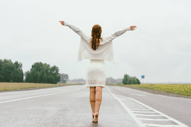 istock A red-haired girl in white clothes. 682279156